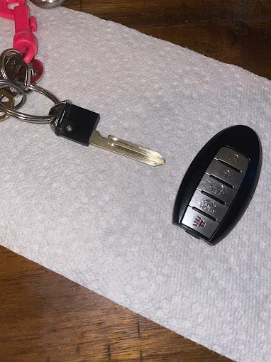 Auto locksmith unlocking a car door during emergency in Downey CA
